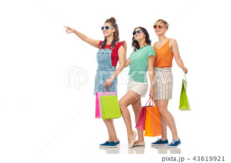 happy female friends with shopping bags happy female friends with shopping bags 43619921