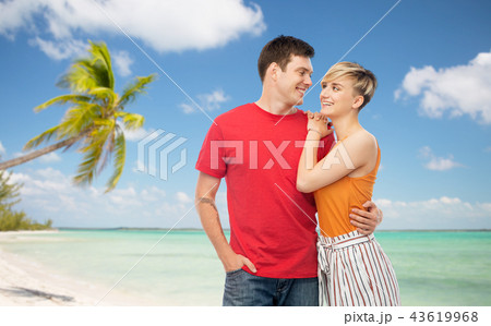 happy couple hugging over white background happy couple hugging over white background 43619968
