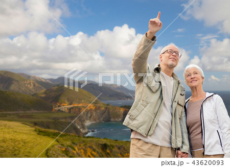 happy senior couple over big sur coast 43620093