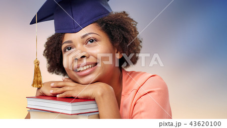 close up of african graduate student with books 43620100