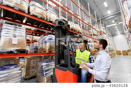 worker and businessman with tablet pc at warehouse 43620128
