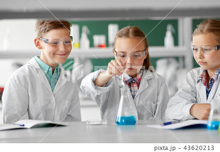 kids with test tube studying chemistry at school kids with test tube studying chemistry at school 43620213