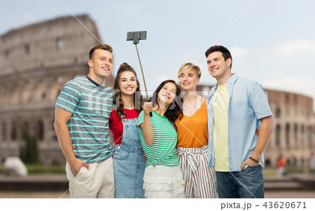 friends taking selfie by monopod over coliseum friends taking selfie by monopod over coliseum 43620671