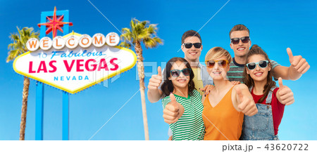 happy friends showing thumbs up happy friends showing thumbs up 43620722