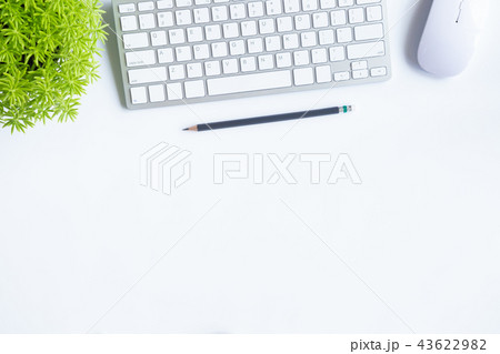 White desk office with laptop, smartphone and othe 43622982