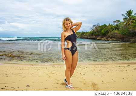 Young happy girl in black bikini  43624335