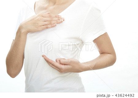 Woman examining herself for breast cancer 43624492