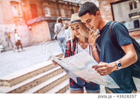 Couple planning route with map Couple planning route with map 43628207