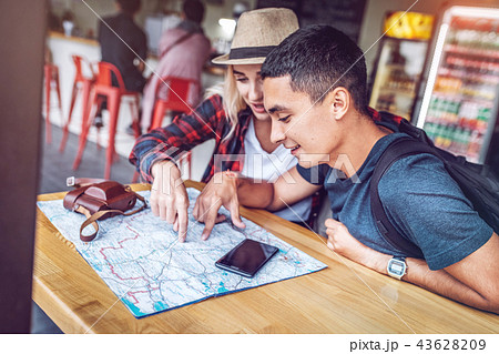 Content couple with map planning route Content couple with map planning route 43628209