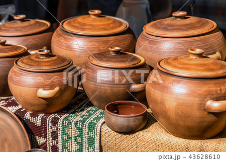 Clay dishes. Crockery made clay. Dishes background 43628610