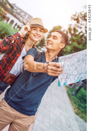 Romantic couple with map exploring city 43628645