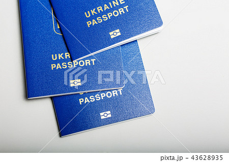 blue Ukrainian biometric passport with an identification chip on a white background blue Ukrainian biometric passport with an identification chip on a white background 43628935