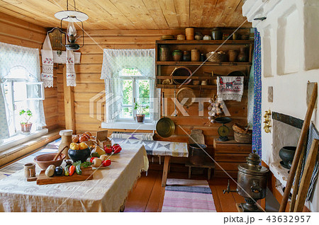 Traditional Russian cottage with oven and crockery. Interior of a peasant hut 43632957