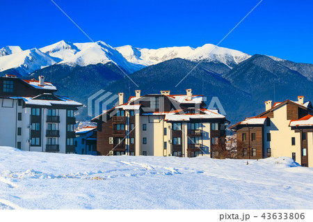 Houses and snow mountains panorama in Bansko, Bulgaria Houses and snow mountains panorama in Bansko, Bulgaria 43633806