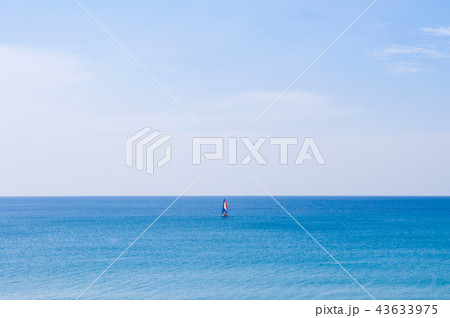 Phuket vibrant blue sea at Mai Khao beach Sailboat Phuket vibrant blue sea at Mai Khao beach Sailboat 43633975