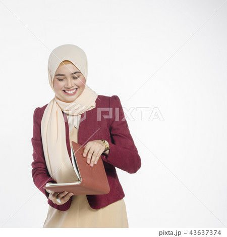 Happy expression of young attractive muslimah Happy expression of young attractive muslimah 43637374
