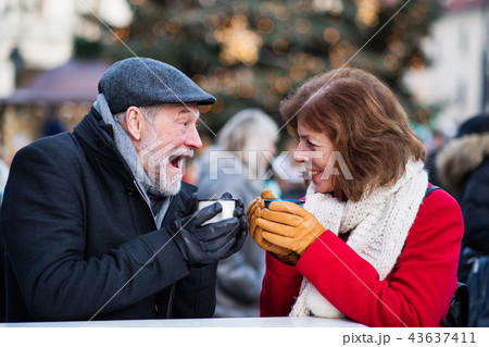 Senior couple on an outdoor Christmas market. 43637411