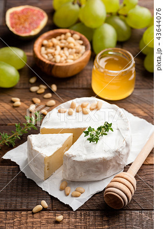Brie or camembert with pine nuts, figs, honey 43644076