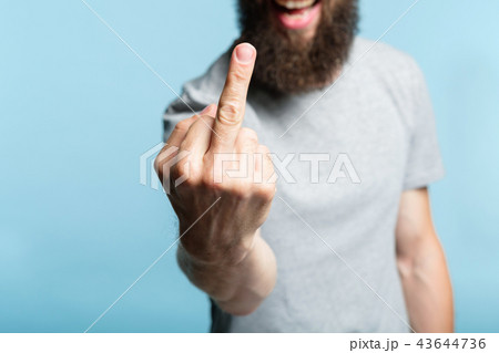 bearded man middle finger rude provocation defiance 43644736