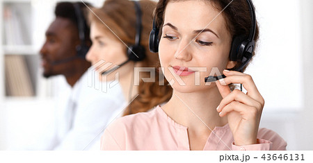 Call center operator.Young beautiful  brunette woman in headset. Business concept 43646131