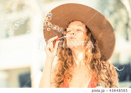 Happy young woman in swimsuit at swimming pool. Happy young woman in swimsuit at swimming pool. 43648565