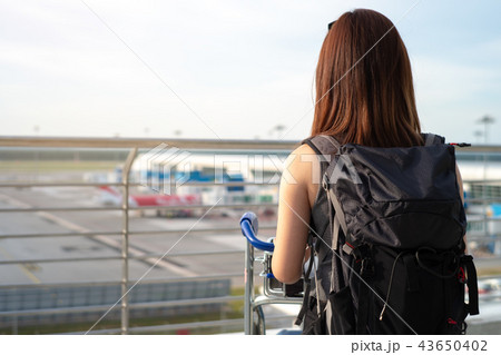 Woman standing at Airport Observation Deck Woman standing at Airport Observation Deck 43650402