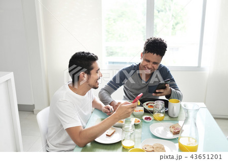Gay Couple Eating Breakfast At Home In the Morning Gay Couple Eating Breakfast At Home In the Morning 43651201