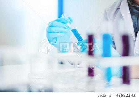 Scientist with equipment holding tools during 43652243