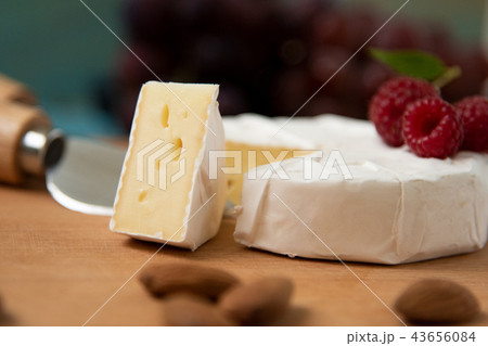 cheese camembert with raspberries and nuts, melange cheese camembert with raspberries and nuts, melange 43656084