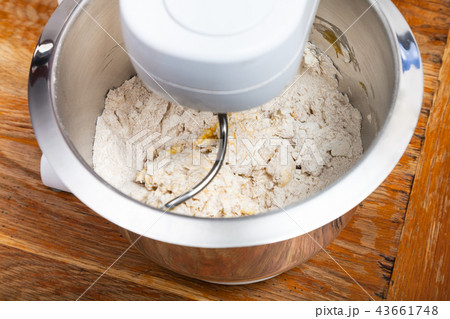 kitchen processor kneads dough with egg 43661748