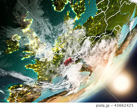 Sun rising above Switzerland from space 43662425