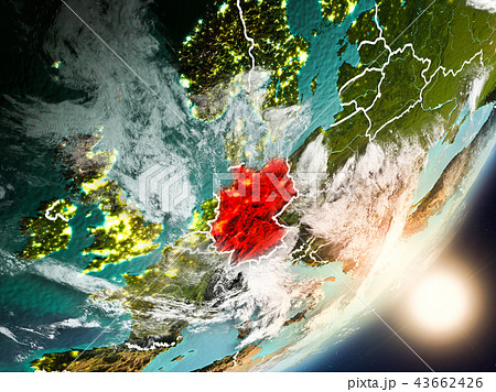 Sun rising above Germany from space 43662426