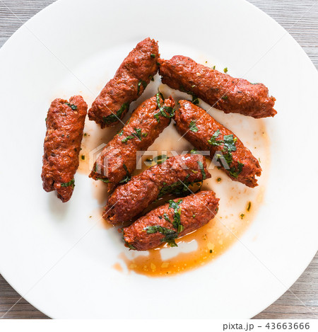 Mutton Seekh Kabab on white plate close up 43663666