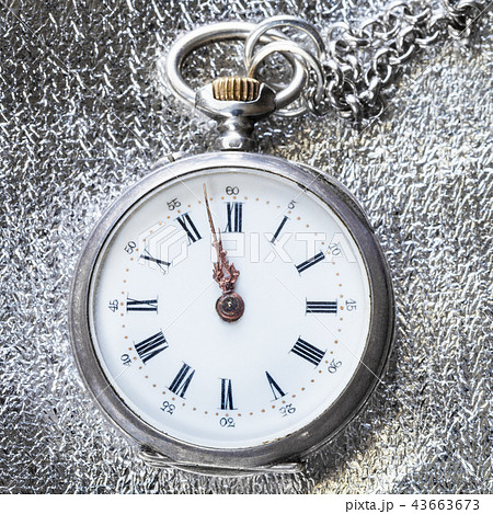 antique pocket watch on silver cloth close up antique pocket watch on silver cloth close up 43663673