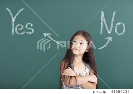 beautiful little girl thinking before chalkboard beautiful little girl thinking before chalkboard 43664252