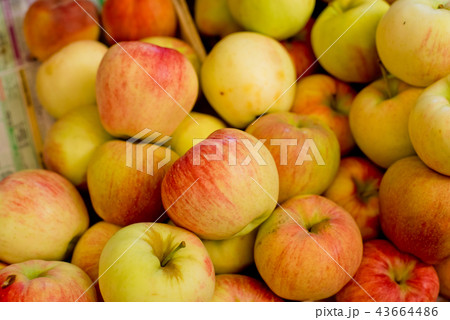 Apples in a box on the market. 43664486