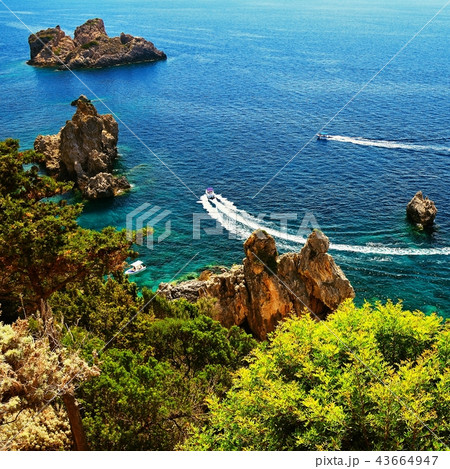 Beautiful beach and boats. Clean sea with a bay. Beautiful beach and boats. Clean sea with a bay. 43664947