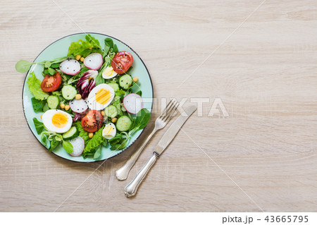 Fresh salad with vegetables for proper nutrition. Fresh salad with vegetables for proper nutrition. 43665795