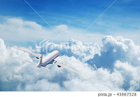 Commercial airplane flying above clouds 43667528