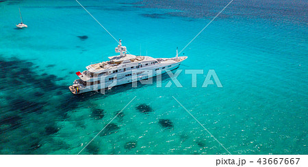 Big luxury yacht anchoring in shallow water, 43667667