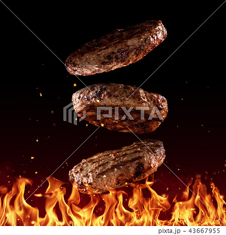 Flying beef minced hamburger pieces on black 43667955