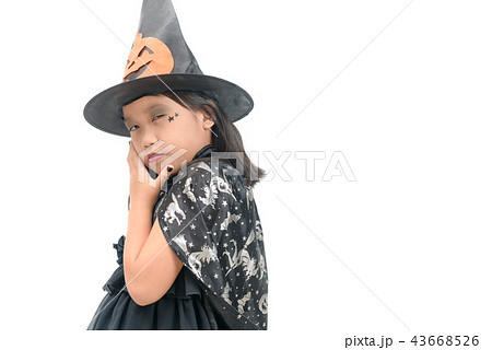 funny child girl in witch costume for Halloween 43668526