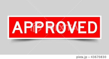 Red sticker with word approved on gray background 43670830