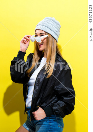 Girl in trendy painted glasses in black jacket 43671123
