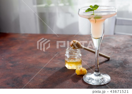 The rose exotic cocktail and figs, honey on brown 43671521
