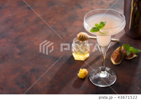 The rose exotic cocktail and figs, honey on brown 43671522