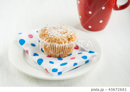 vanilla muffin-cake dusted with powdered sugar vanilla muffin-cake dusted with powdered sugar 43672681