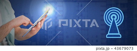 Hand holding tablet with signal icon 43679073
