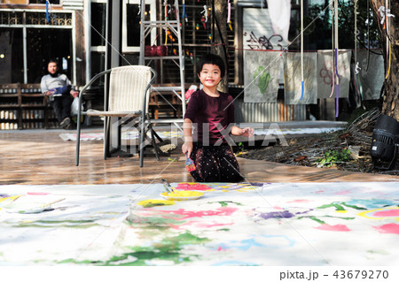 Asian little girl painting and drawing on paper 43679270