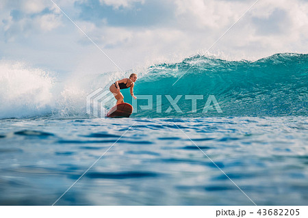 Surf woman ride on surfboard. Woman in ocean 43682205